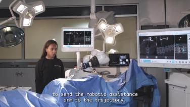 women in front of medical device machines from VELYS Spine System Overview